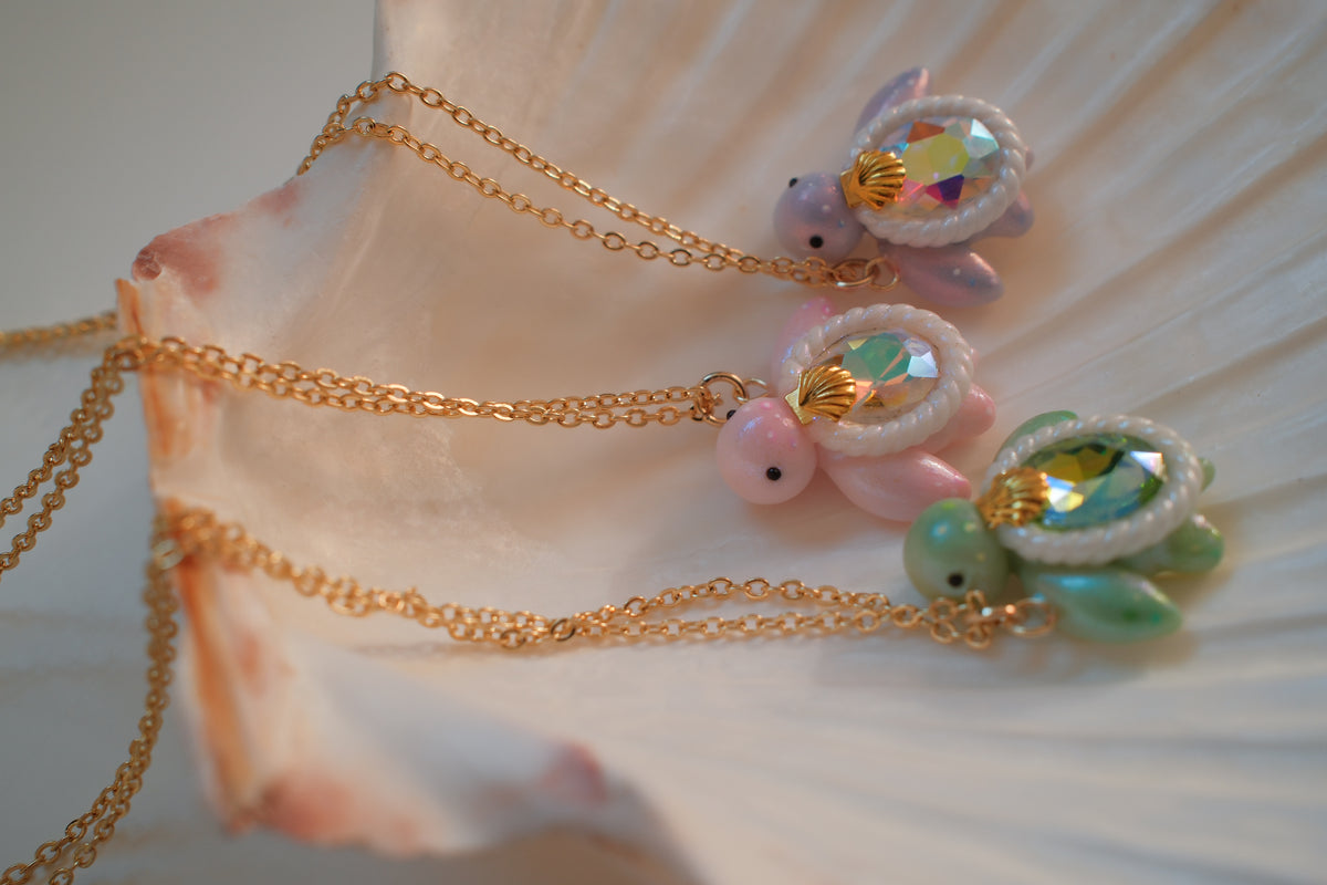 Gemstone Turtle Necklaces - Mini turtle necklaces handcrafted from glass gemstones and polymer clay, embelished with paint and various types of micro glitters.
