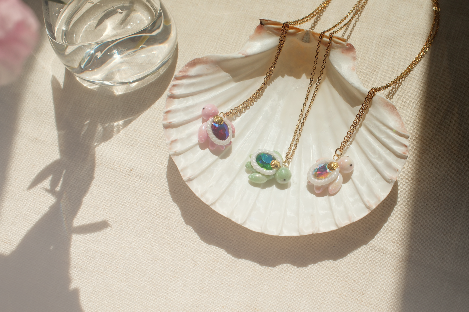 Gemstone Turtle Necklaces - Mini turtle necklaces handcrafted from glass gemstones and polymer clay, embelished with paint and various types of micro glitters.